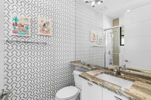 a bedroom with furniture and a chandelier