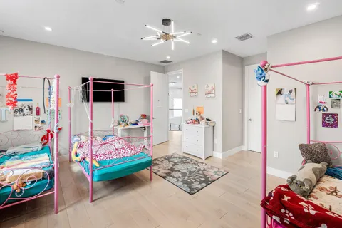 a view of swimming pool with lounge chair in the patio