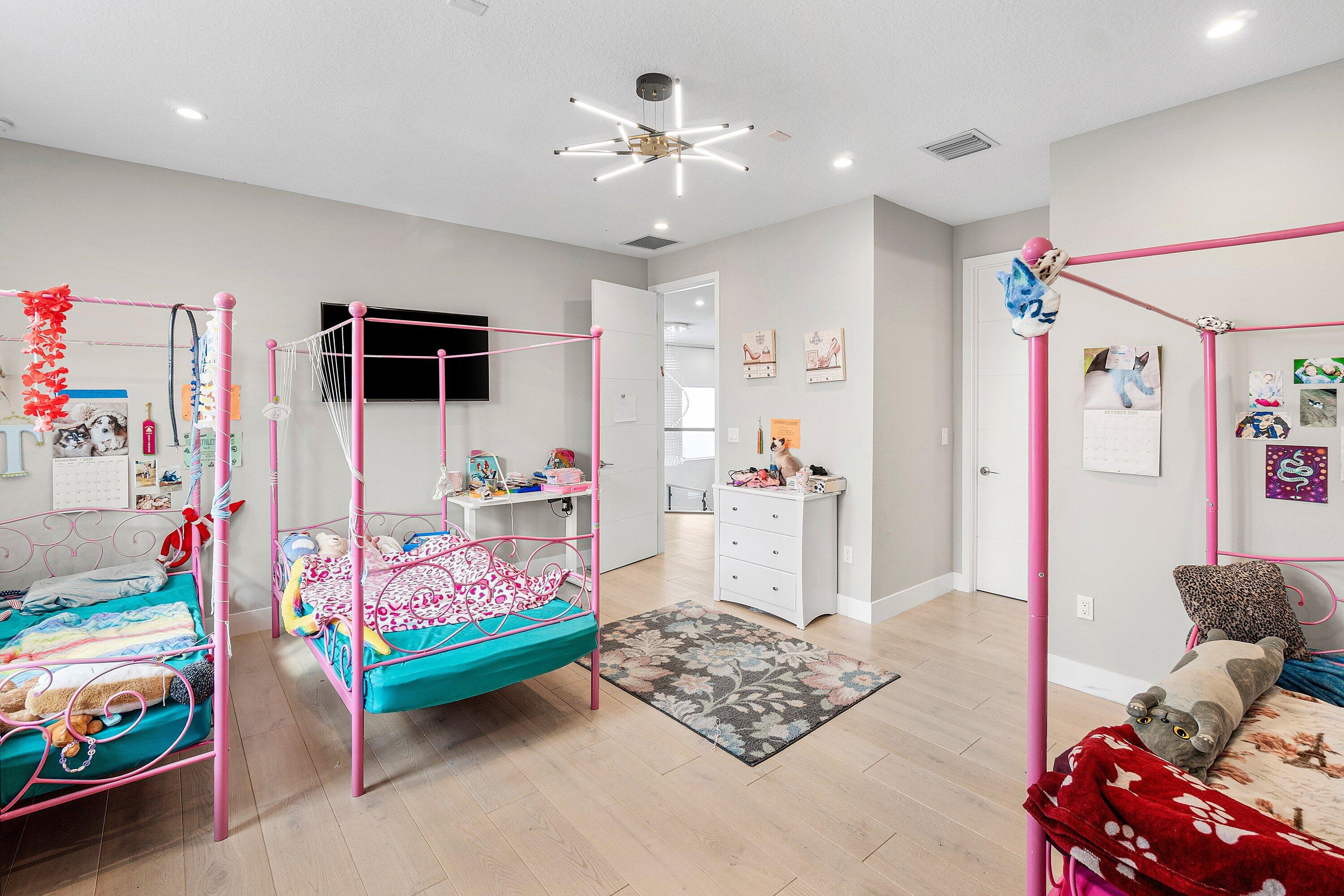 17238 Teton River Road Boca Raton, FL 33496 - Photo 38 of 67 a bedroom with furniture and a chandelier