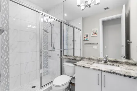 a view of a lake with houses in the back