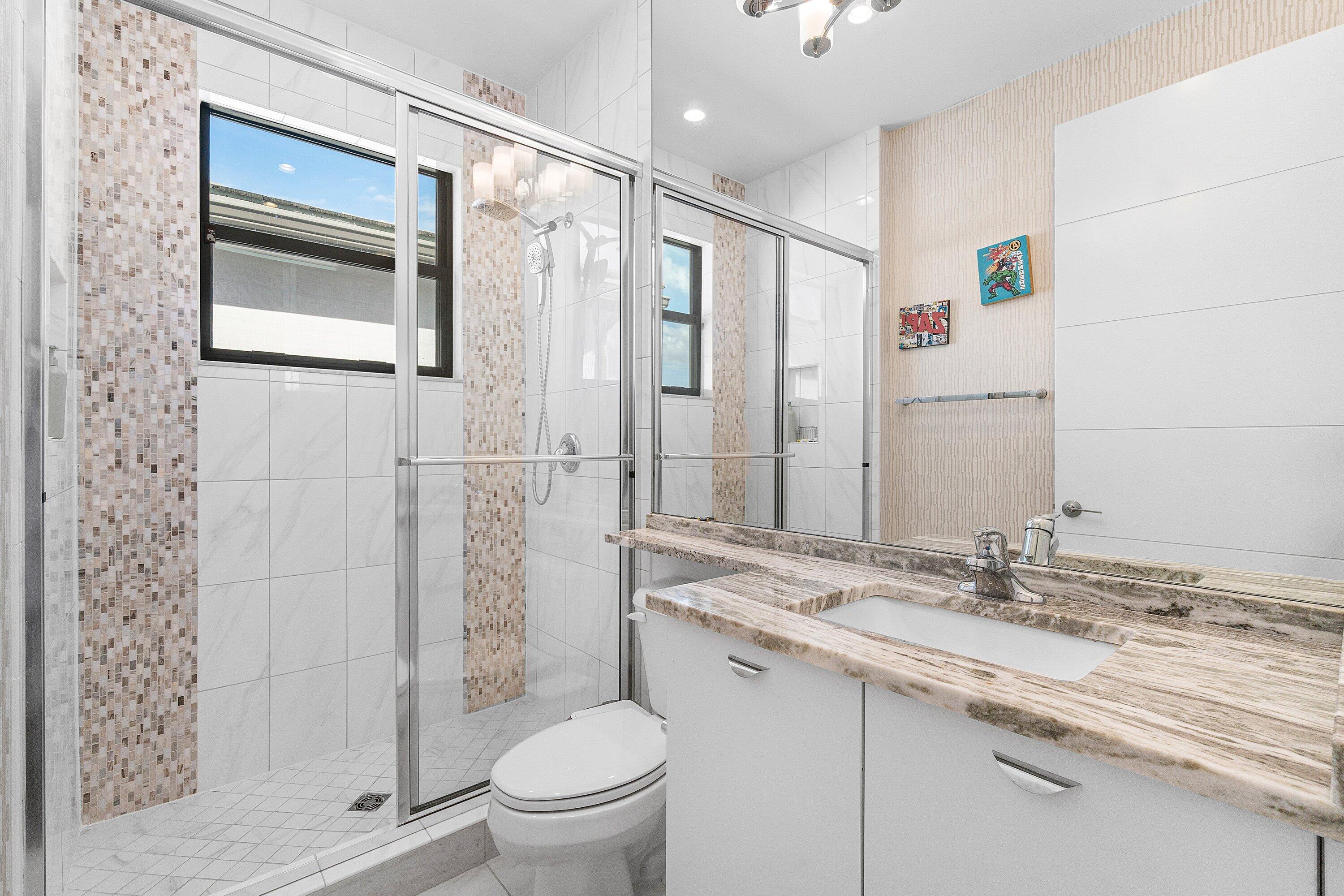 17238 Teton River Road Boca Raton, FL 33496 - Photo 41 of 67 a bathroom with a granite countertop sink toilet and shower
