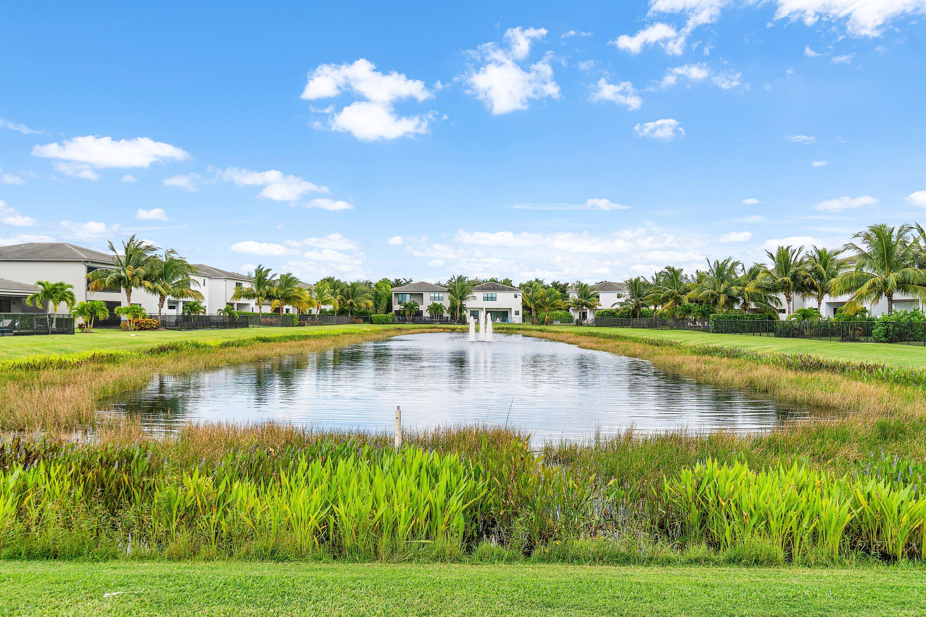 17238 Teton River Road Boca Raton, FL 33496 - Photo 47 of 67 a view of a lake with houses in the back