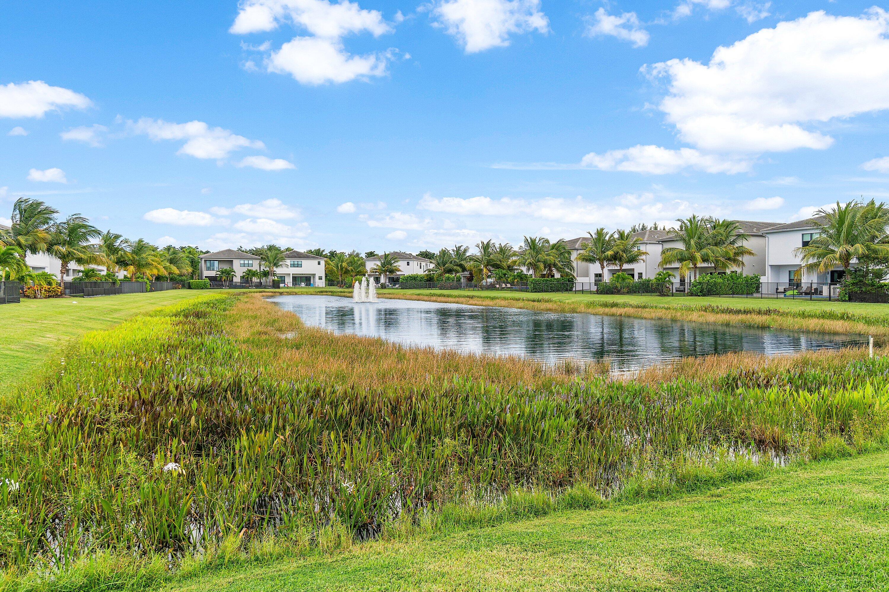 17238 Teton River Road Boca Raton, FL 33496 - Photo 48 of 67 a view of a lake with houses in the background