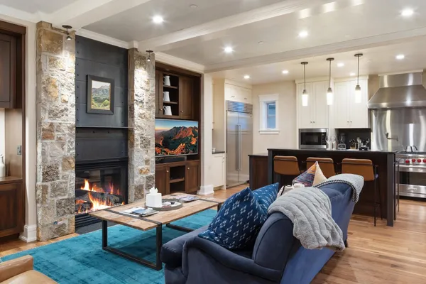 a living room with furniture and a fireplace