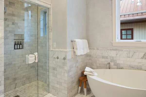 a bedroom with a bed and a view of bathroom