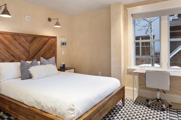 a bedroom with a bed and a couch