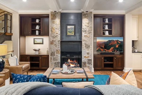 a living room with furniture and a fireplace
