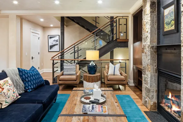 a living room with furniture or couch and a wooden floor