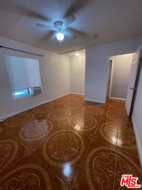 604 Eye Street Bakersfield, CA 93304 - Photo 25 of 33 a bedroom with a bed and a lamp on dresser