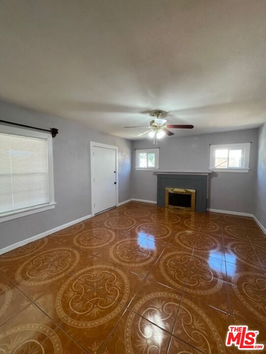 604 Eye Street Bakersfield, CA 93304 - Photo 32 of 33 a bedroom with a bed and a fireplace