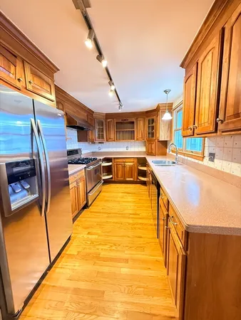 a swimming pool with outdoor seating and outdoor shower