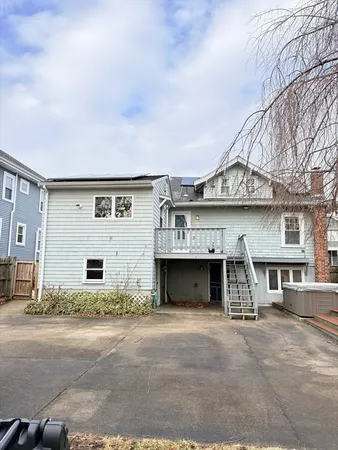 a large tree in front of a house