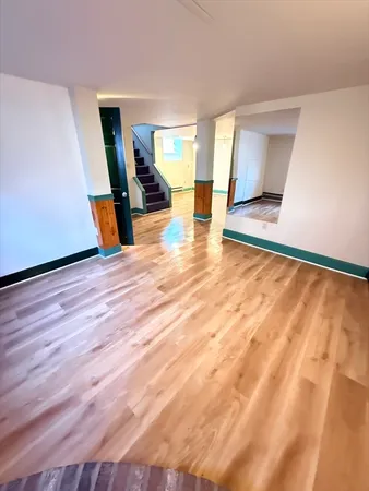 a view of a room with wooden floor and air conditioner