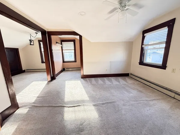 a view of a hallway with a window