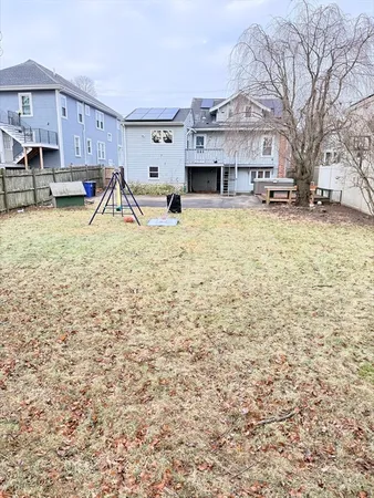 a view of residential houses with yard