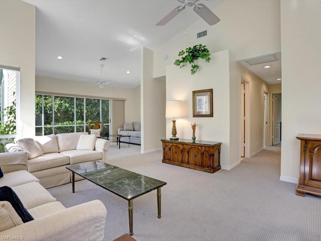 15335 Wimborne Lane Naples, FL 34110 - Photo 11 of 33 a living room with furniture and wooden floor
