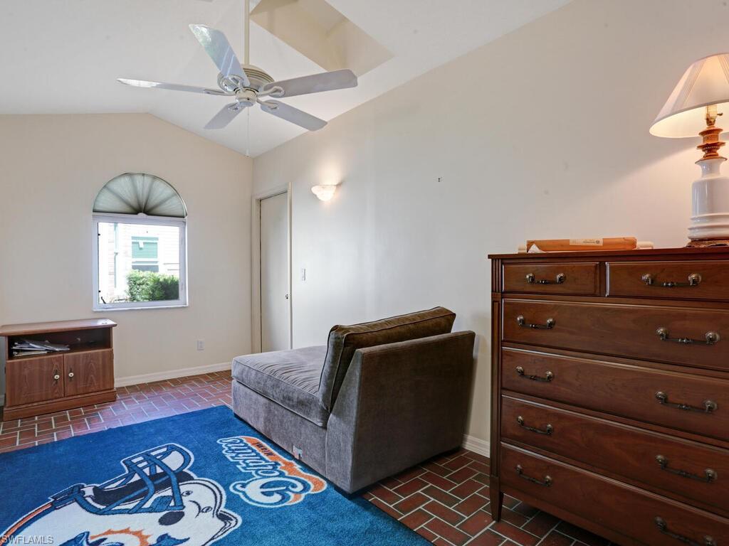 15335 Wimborne Lane Naples, FL 34110 - Photo 31 of 33 a living room with furniture and a wooden floor