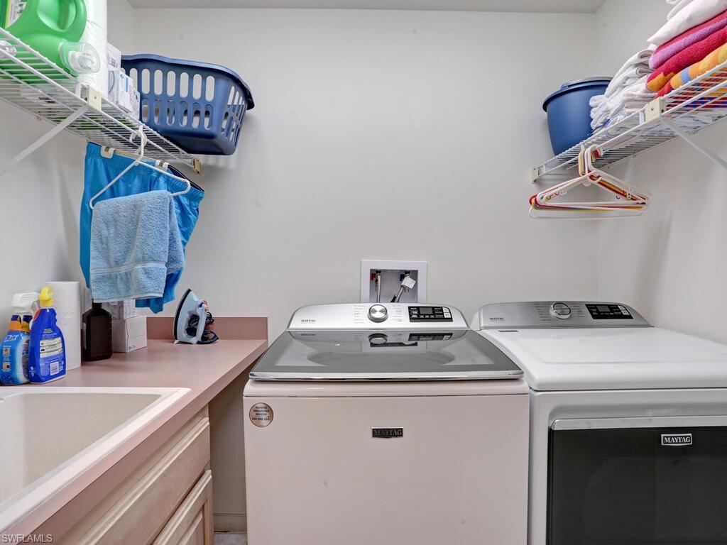 15335 Wimborne Lane Naples, FL 34110 - Photo 33 of 33 a utility room with dryer and washer