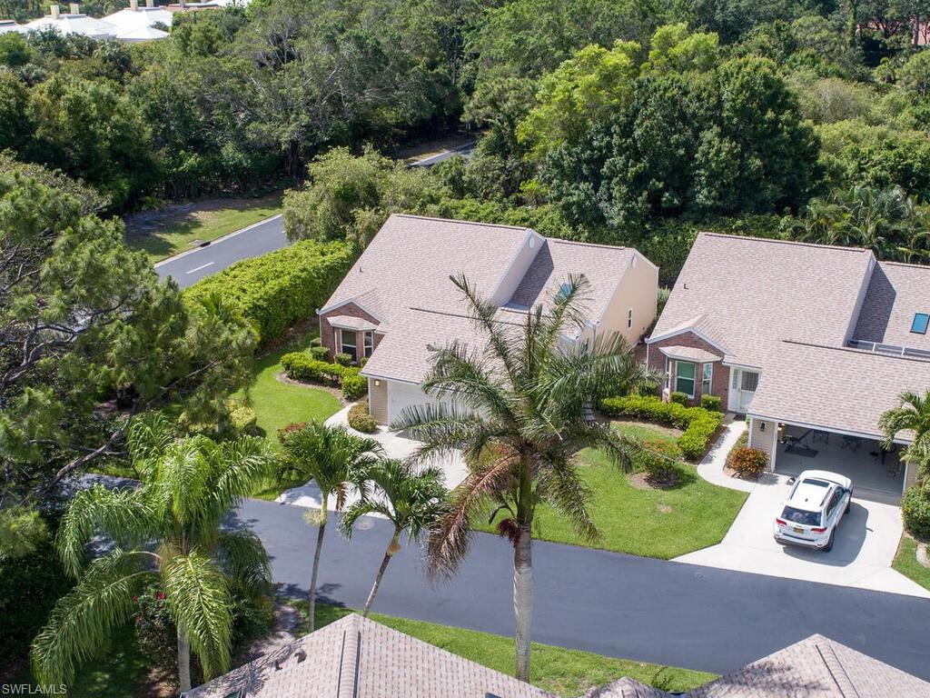 15335 Wimborne Lane Naples, FL 34110 - Photo 4 of 33 an aerial view of multiple houses with yard