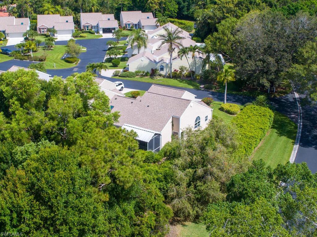 15335 Wimborne Lane Naples, FL 34110 - Photo 5 of 33 an aerial view of a house with a garden
