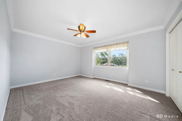 an empty room with window and outdoor view