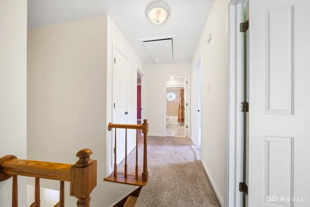 a view of a hallway and interior of the house