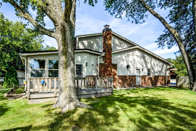a view of a house with a yard porch and sitting area