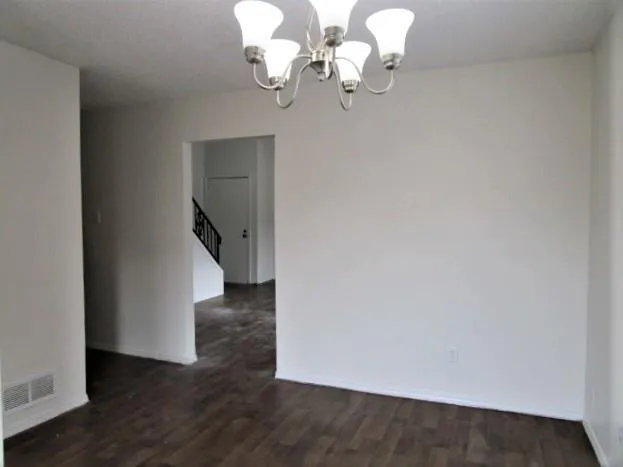 a view of kitchen with hallway