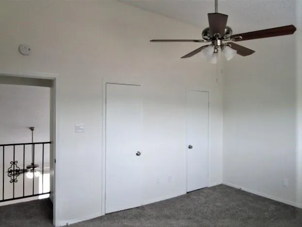 a view of room with a ceiling fan