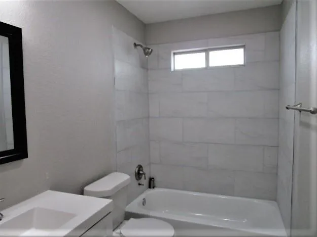 a bathroom with a toilet and a sink