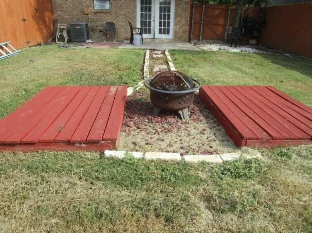 a backyard of a house with yard and trampoline