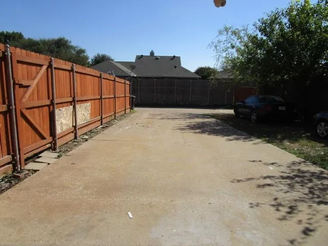 a view of swimming pool with a yard