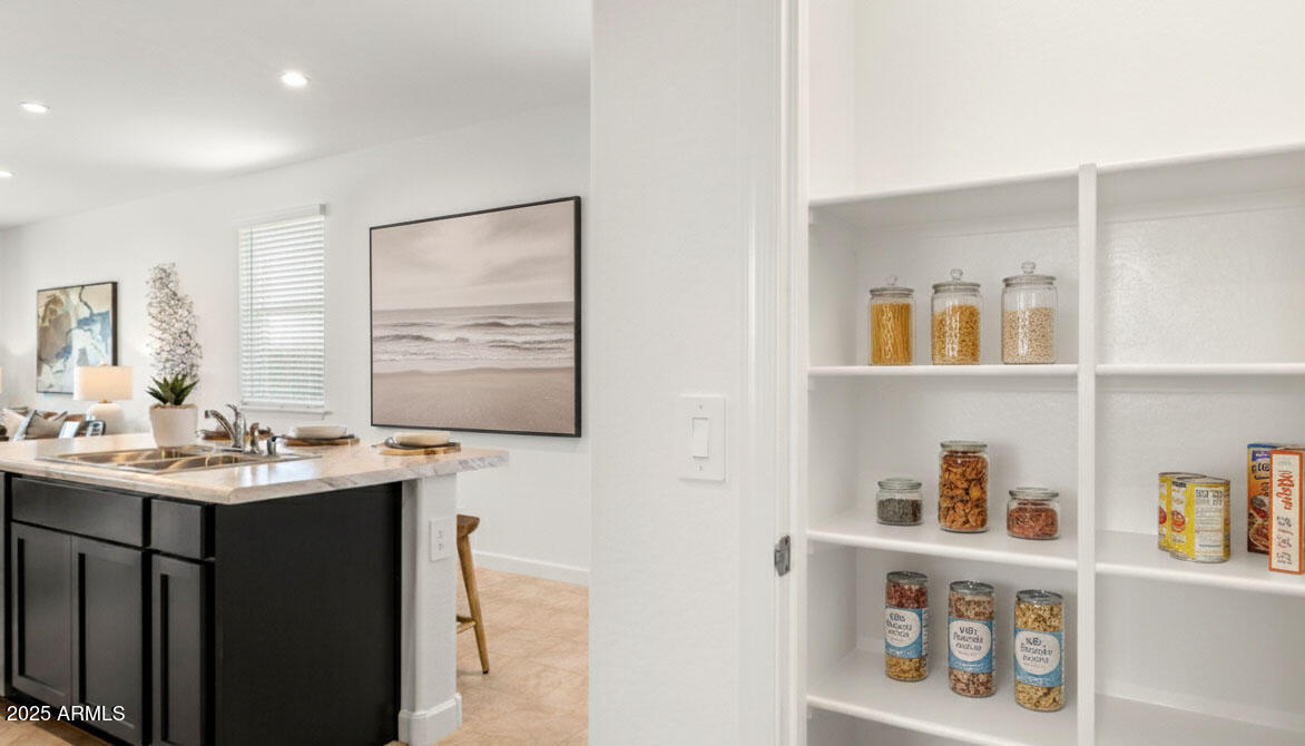 3274 West Stradling Avenue Apache Junction, AZ 85120 - Photo 12 of 35 a bathroom with a sink a large mirror and a shower
