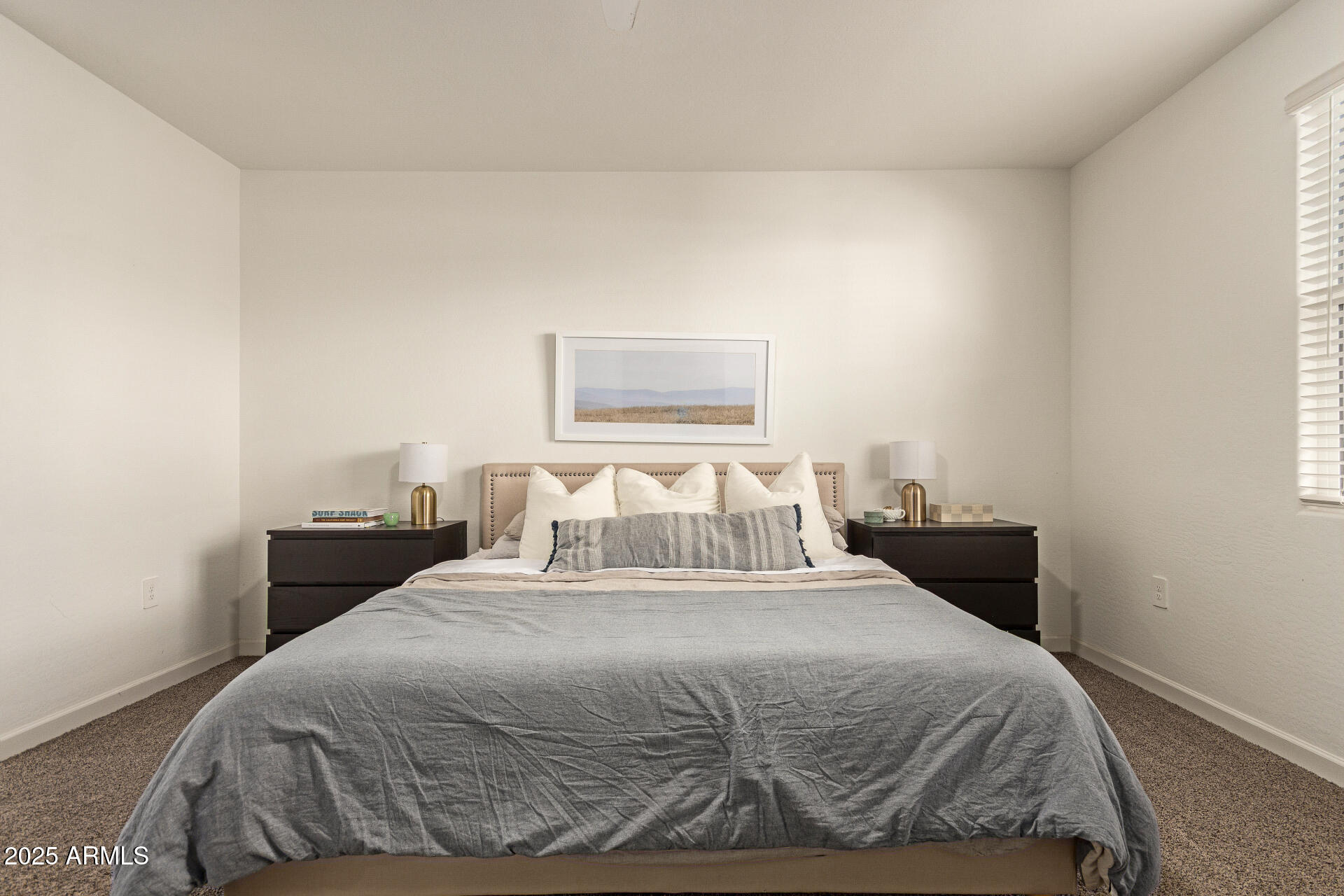 3274 West Stradling Avenue Apache Junction, AZ 85120 - Photo 15 of 35 a bedroom with a bed and a painting on the wall