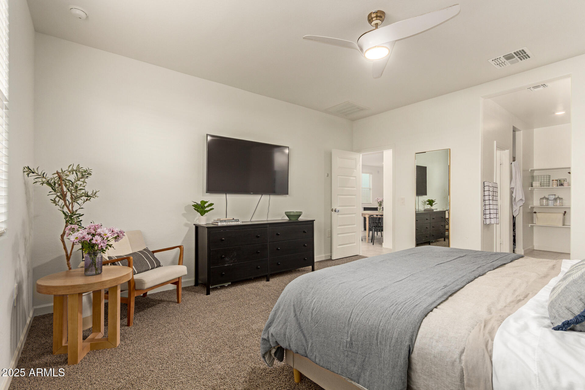 3274 West Stradling Avenue Apache Junction, AZ 85120 - Photo 16 of 35 a bedroom with a bed and a flat screen tv