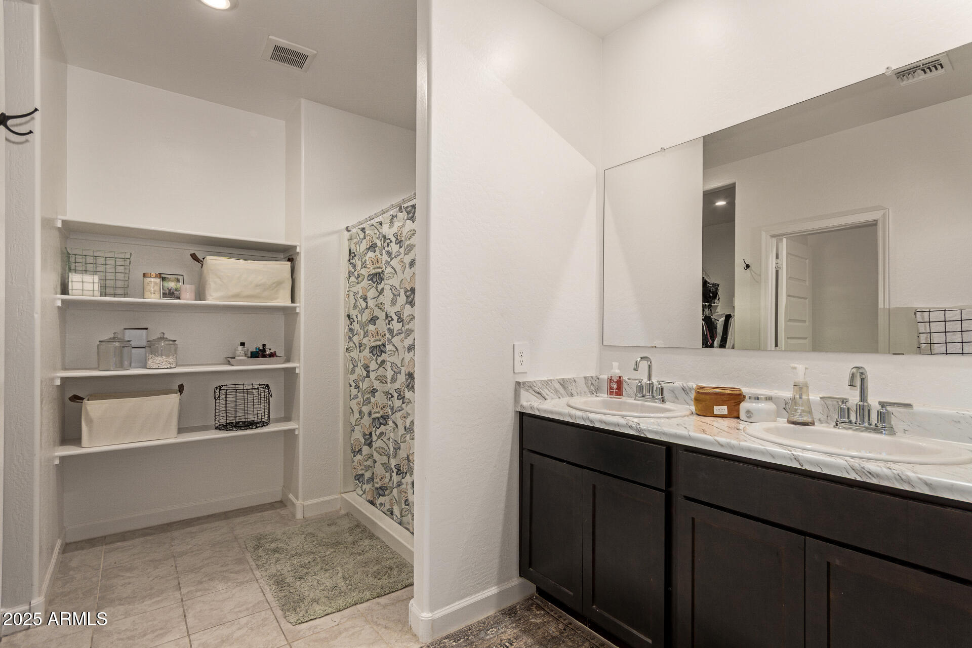 3274 West Stradling Avenue Apache Junction, AZ 85120 - Photo 17 of 35 a bathroom with a sink and a mirror