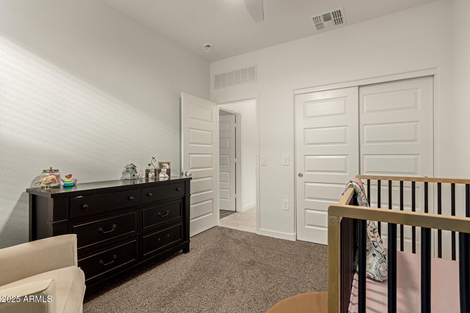 3274 West Stradling Avenue Apache Junction, AZ 85120 - Photo 21 of 35 a room with a dresser and a mirror