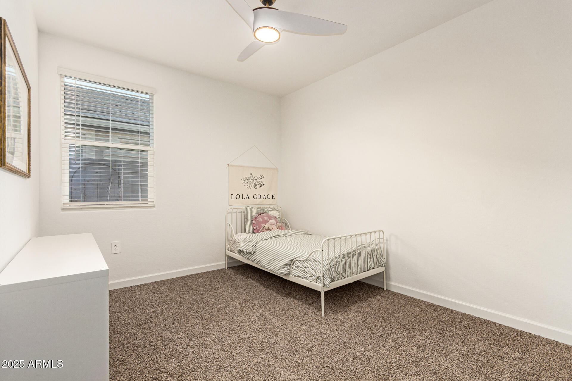 3274 West Stradling Avenue Apache Junction, AZ 85120 - Photo 22 of 35 a room with a bed and a window