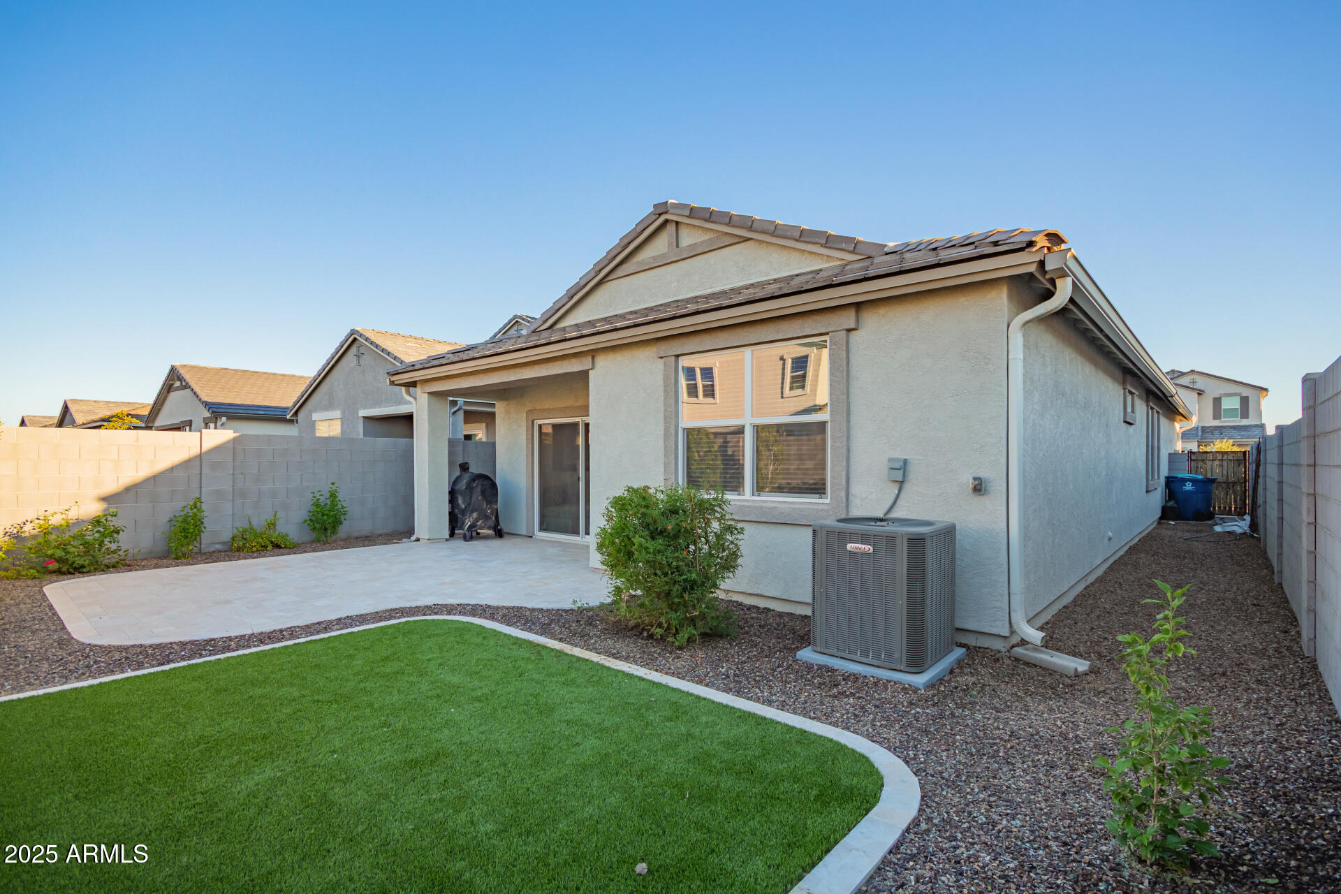 3274 West Stradling Avenue Apache Junction, AZ 85120 - Photo 27 of 35 a front view of a house with a yard and potted plants