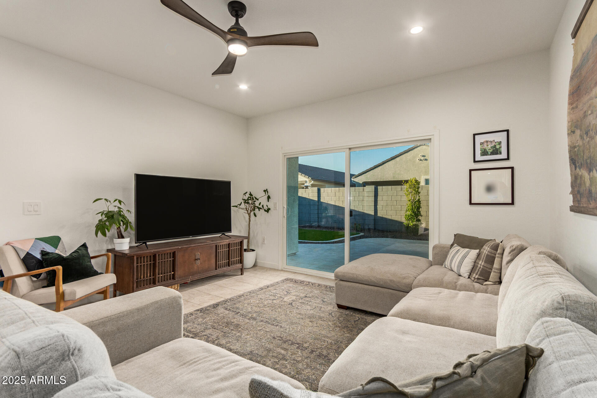 3274 West Stradling Avenue Apache Junction, AZ 85120 - Photo 6 of 35 a living room with furniture and a flat screen tv