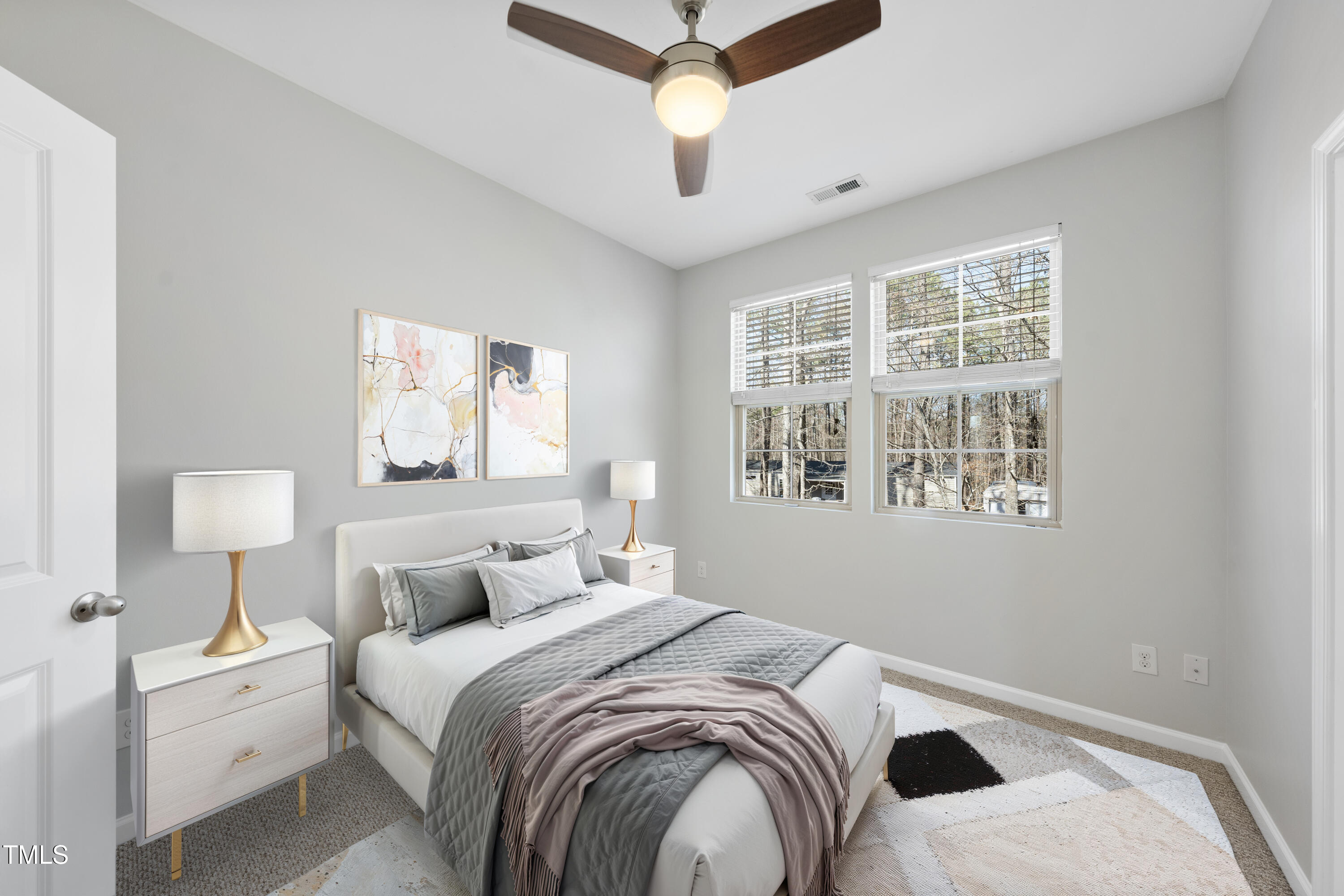 684 Wickham Ridge Road Apex, NC 27539 - Photo 11 of 18 a bedroom with a bed and a large window