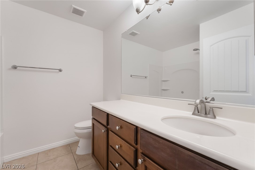 3175 Via Seranova Henderson, NV 89044 - Photo 31 of 45 This clean bathroom features a spacious vanity with ample storage and a bright, reflective mirror.