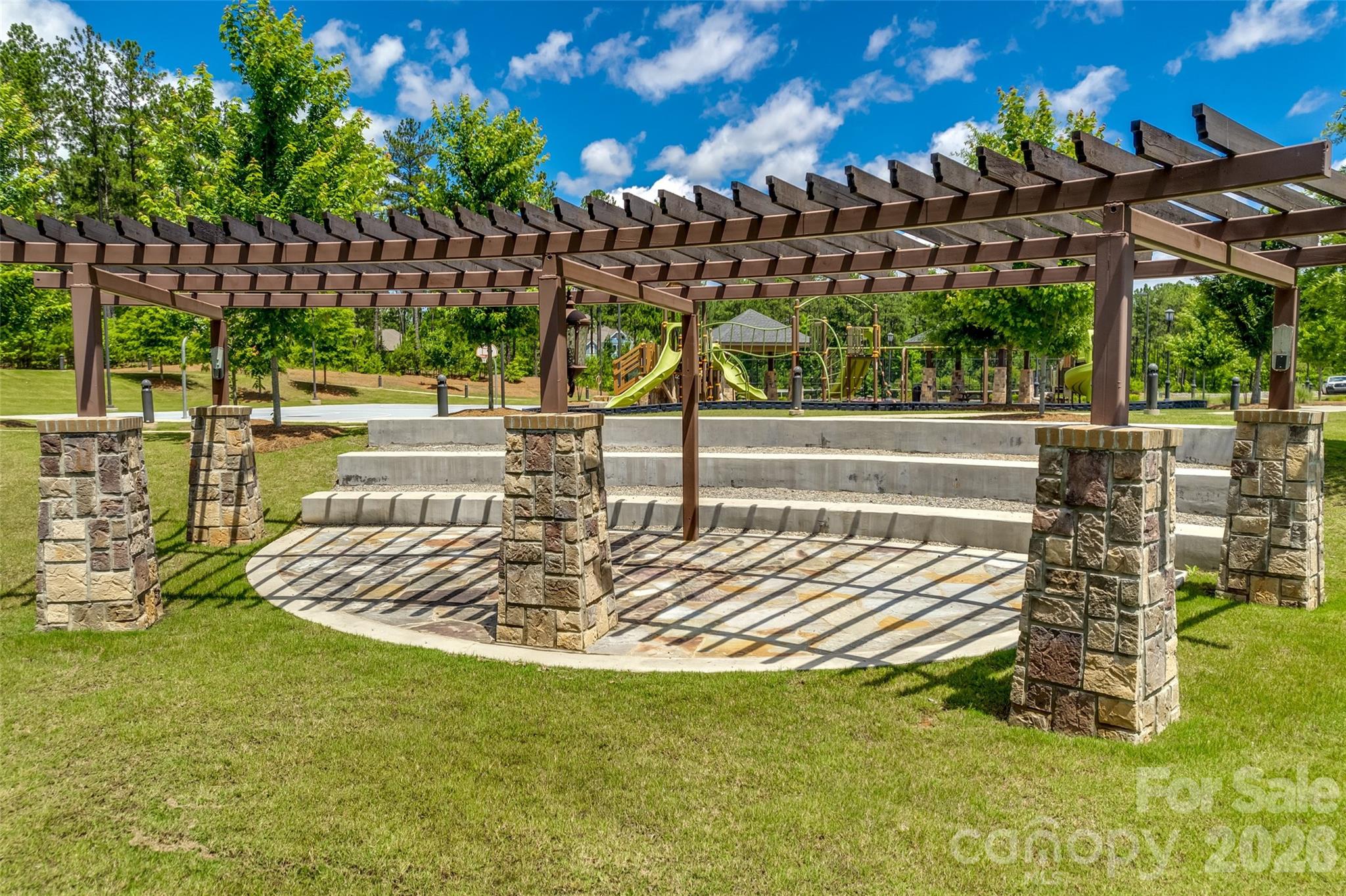 6121 Chimney Bluff Road, Unit 6 Lancaster, SC 29720 - Photo 21 of 25 a view of swimming pool with lawn chairs and plants