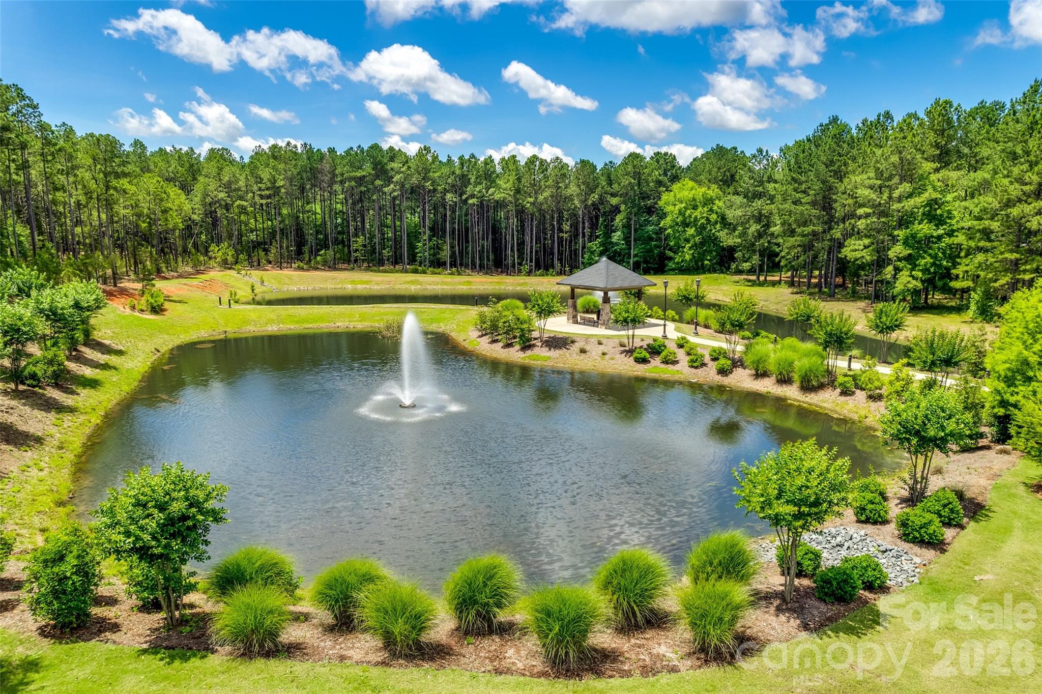 6121 Chimney Bluff Road, Unit 6 Lancaster, SC 29720 - Photo 22 of 25 a view of a lake with a house