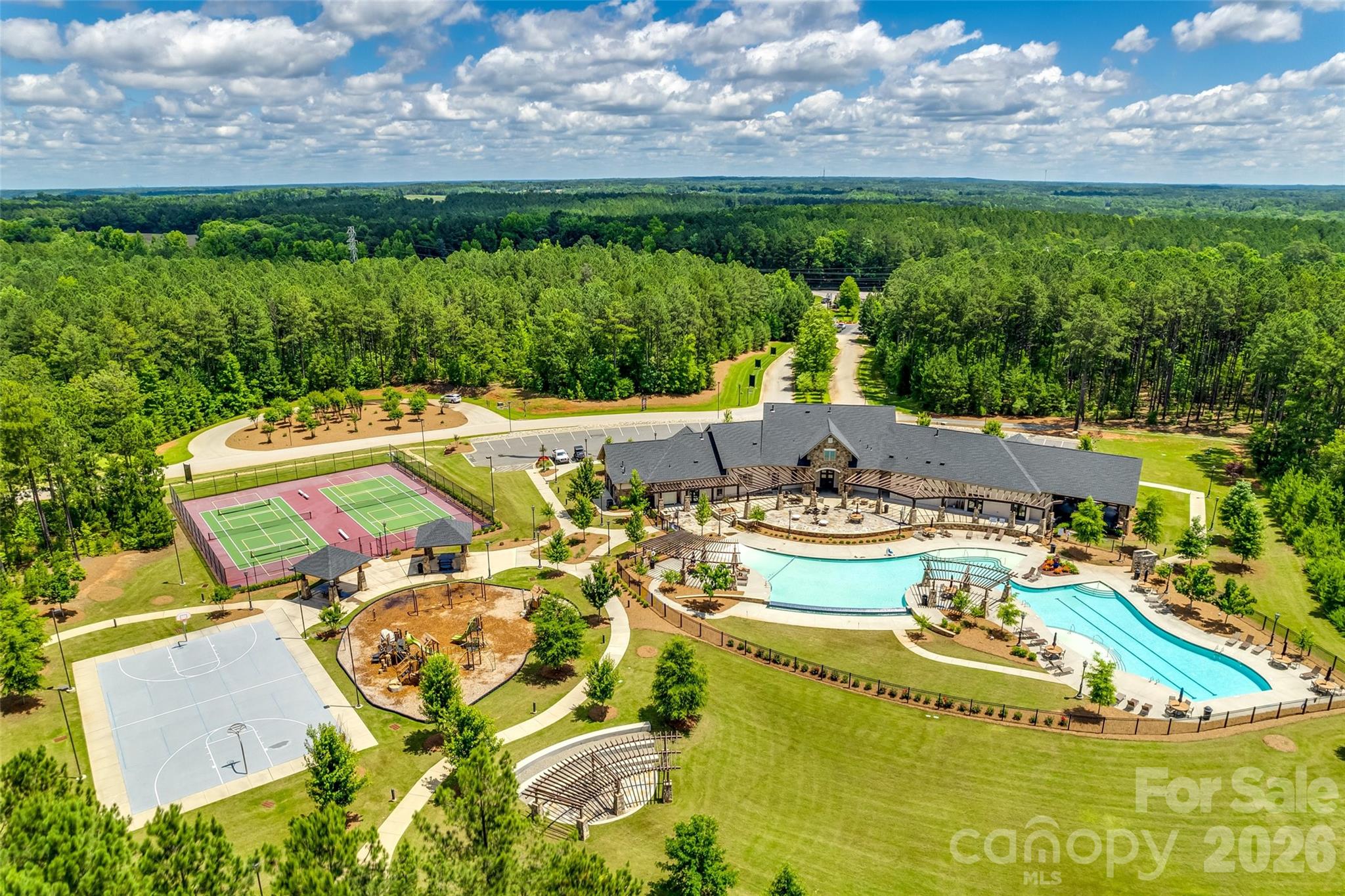 6121 Chimney Bluff Road, Unit 6 Lancaster, SC 29720 - Photo 25 of 25 a view of a swimming pool with lawn chairs and plants