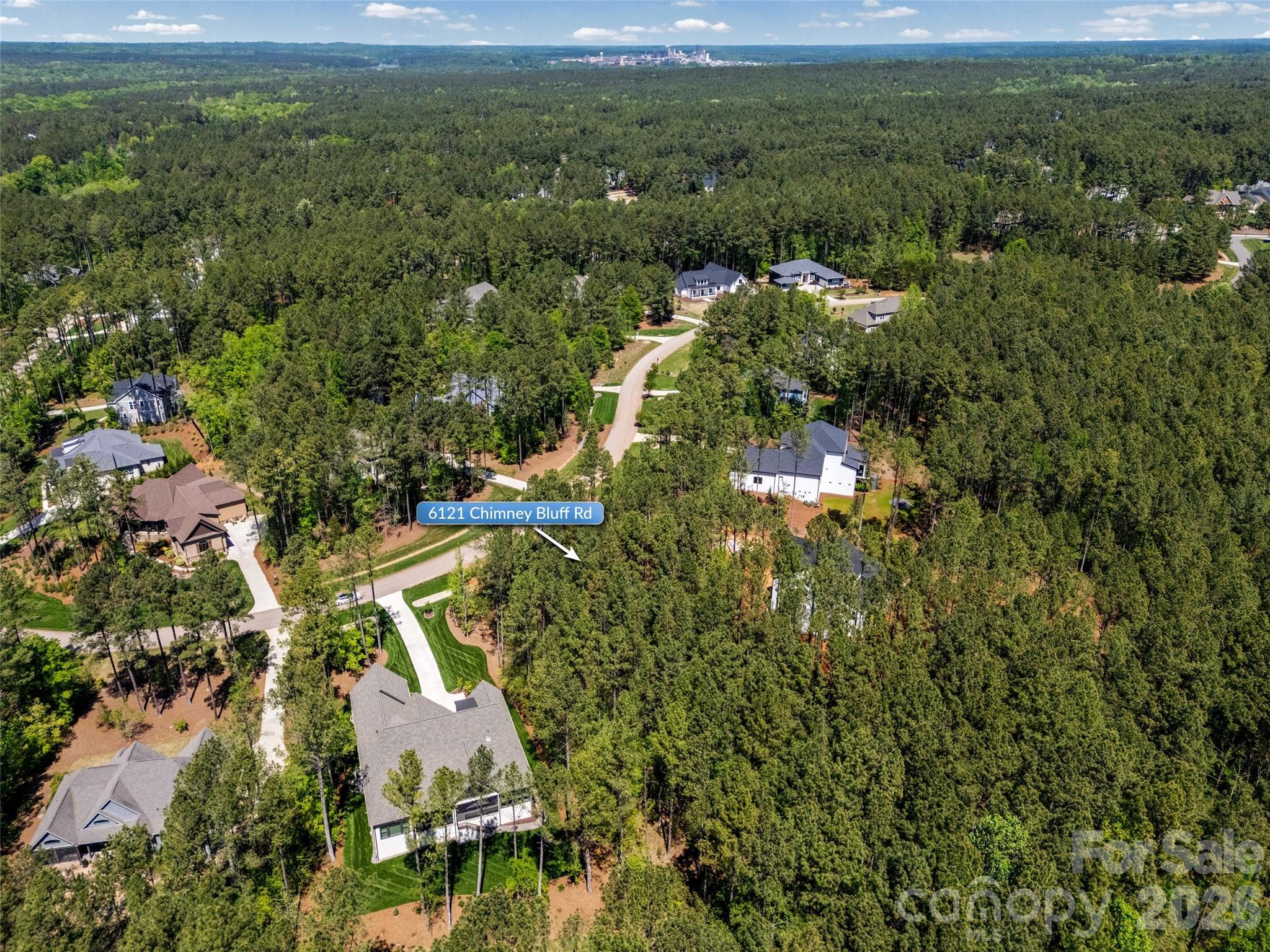 6121 Chimney Bluff Road, Unit 6 Lancaster, SC 29720 - Photo 9 of 25 an aerial view of residential houses with outdoor space and trees