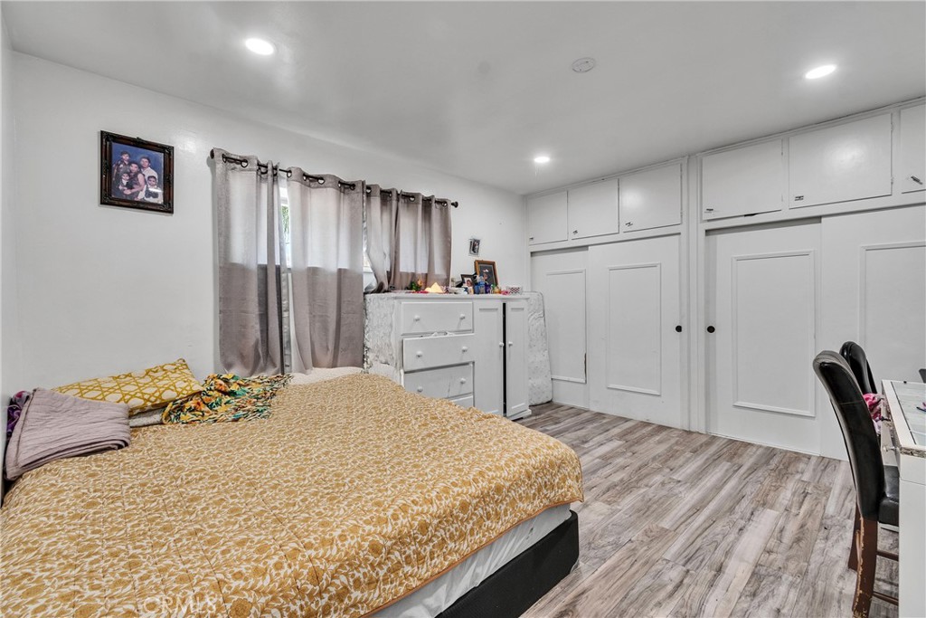 5121 Sierra Street Riverside, CA 92504 - Photo 27 of 34 a spacious bedroom with a bed and a dresser