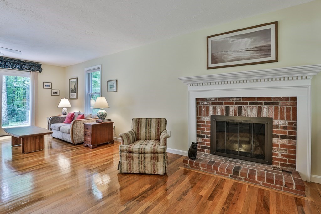 100 Stagecoach Road Lancaster, MA 01523 - Photo 11 of 29 a living room with furniture and a fireplace