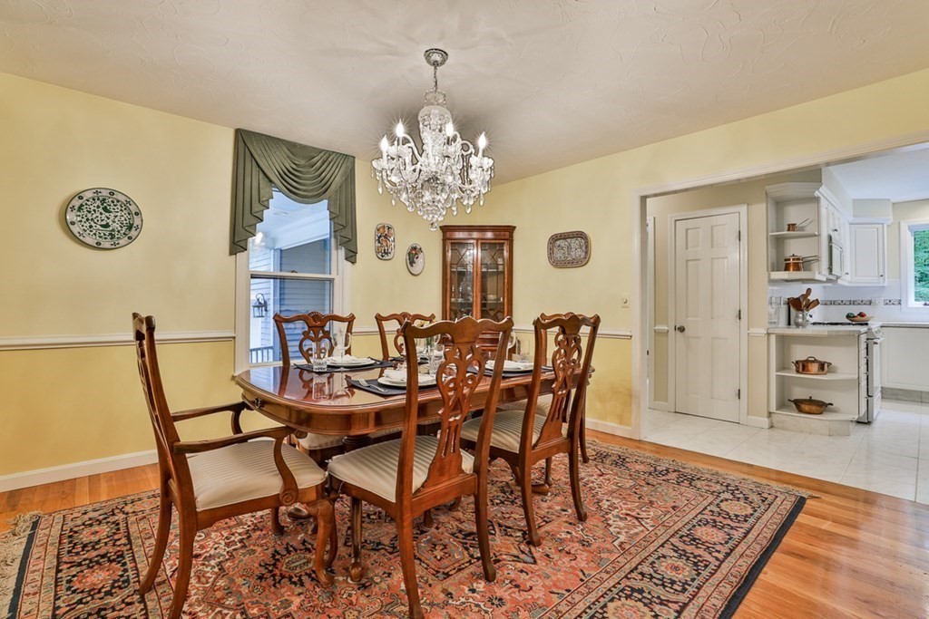 100 Stagecoach Road Lancaster, MA 01523 - Photo 12 of 29 a view of a dining room with furniture and chandelier