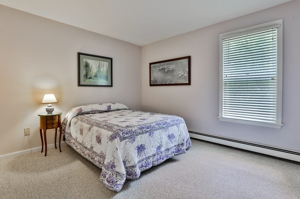 100 Stagecoach Road Lancaster, MA 01523 - Photo 17 of 29 a bedroom with a bed and a window